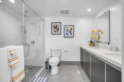 a bathroom with a toilet and a shower and a sink at Amazing, Spacious Unit, Heart LA in Los Angeles