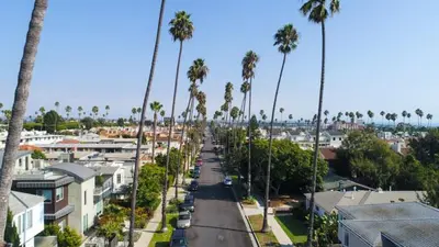 a city street with palm trees and houses at The Orchid-Beachfront Bliss Spacious 2BR Apt In Santa Monica in Los Angeles
