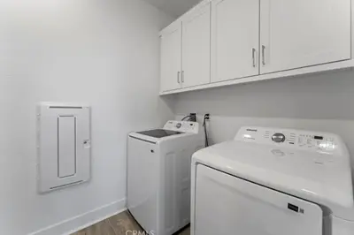 a white laundry room with a washer and dryer at Luxury 4 bedroom house Los Angeles in Castaic Junction