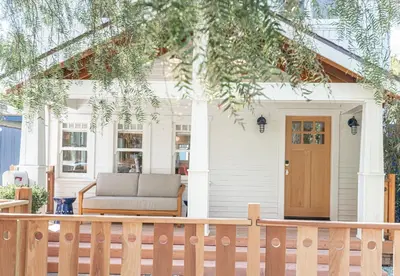a house with a porch with a couch at Walk to Venice Beach from Luxury home in Los Angeles