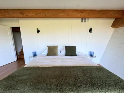 a bedroom with a large bed with two pillows at Architectural Marvel in Hollywood Hills with Views in Los Angeles