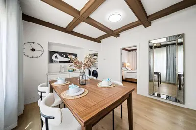 a dining room with a wooden table and chairs at 2Bedroom home for your comfort and relaxation in Alhambra