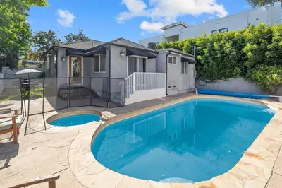 a swimming pool in front of a house at Elegance Escape Sleeps 10 Pool with Jacuzzi in Los Angeles