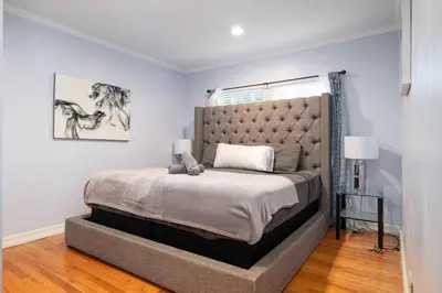 a bedroom with a large bed in a room at Elegance Escape Sleeps 10 Pool with Jacuzzi in Los Angeles