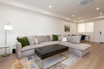 a living room with a couch and a table at Stylish Apartments in Glendale with Free Parking in Glendale