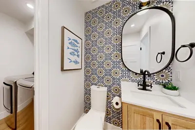 a bathroom with a sink and a mirror at Mickey's Hideaway in Anaheim