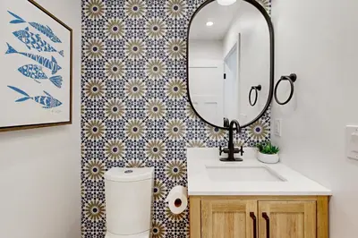 a bathroom with a sink and a mirror at Mickey's Hideaway in Anaheim