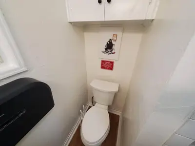 a small bathroom with a toilet in a small room at Hollywood - Budget Private Quiet 2nd Flr 1BR and 1BA in Los Angeles