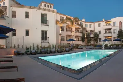 a swimming pool in front of a building at Cozy Resort-Style Experience - Garden View in Los Angeles