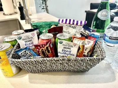 a basket filled with different types of food on a counter at Cozy Resort-Style Experience - Garden View in Los Angeles
