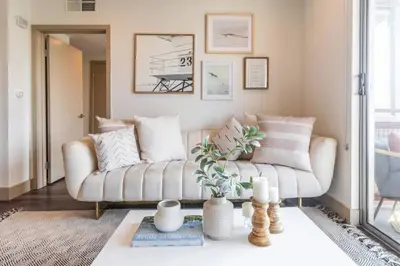 a living room with a couch and a table at Trendy 2BD 2BTH Apt steps from Downtown Santa Monica! in Los Angeles