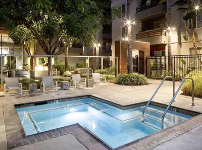 a swimming pool in front of a building at Stunning 2BD 2BTH Apt in Santa Monica! in Los Angeles
