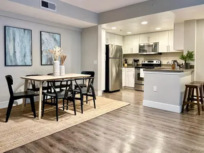 a kitchen and dining room with a table and chairs at Stunning 2BD 2BTH Apt in Santa Monica! in Los Angeles