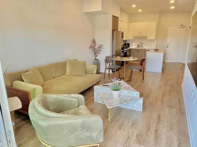 a living room with a couch and a table at Designer Silver Lake Stylish One Bedroom with Parking in Los Angeles