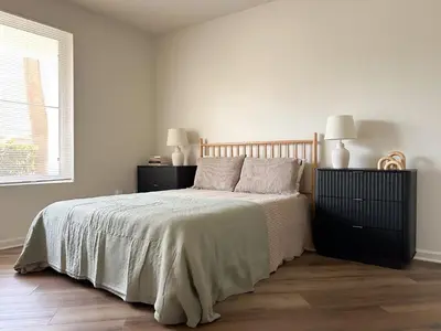 a bedroom with a bed with two night stands and two lamps at Big 3BD 2BA Apt with Pool and Gym near Venice Beach in Los Angeles