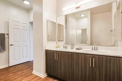 a bathroom with two sinks and a large mirror at Big 3BD 2BA Apt with Pool and Gym near Venice Beach in Los Angeles