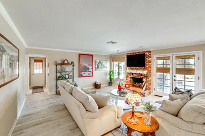 a living room with two couches and a tv at Pet-Friendly Riverside Retreat with Private Spa! in Riverside