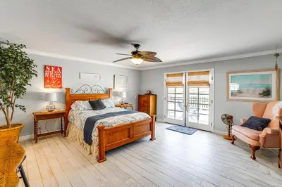 a bedroom with a bed and a ceiling fan at Pet-Friendly Riverside Retreat with Private Spa! in Riverside