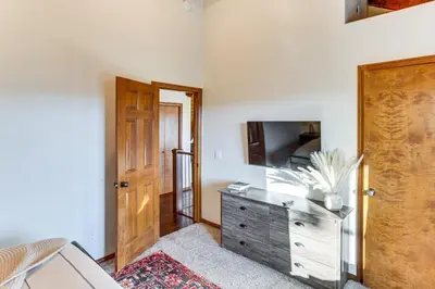 a room with a dresser with a television on it at Lake Arrowhead Cabin 4 Decks, Game Room and More! in Lake Arrowhead