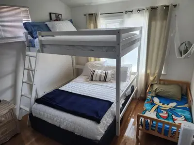 a bedroom with two bunk beds in a room at The Coastal Comfort in Oxnard