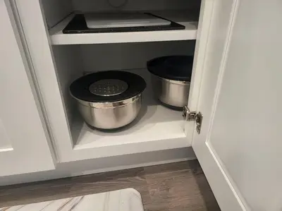 three pots and pans inside of a kitchen door at High Desert Dream on the Fairway WiFi Smart TVs in Victorville