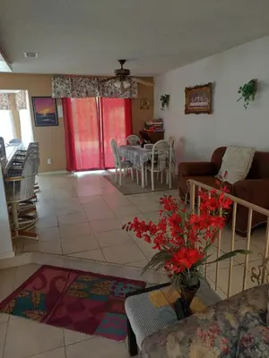 a living room with a couch and a table at Lyons lovely house in Hesperia