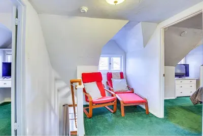 two chairs and a table in a room at The Twin Pines Chalet, 2 min to Village, BBQ in Big Bear Lake