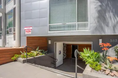 a building with a staircase in front of a building at Blueground Mid-Wilshire pool ac nr retail LAX-1265 in Los Angeles