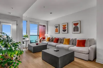 a living room with a couch and a table at Modern & chic in Heart of Downtown Santa Monica in Los Angeles