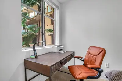 an office with a desk and a chair and a window at Modern & chic in Heart of Downtown Santa Monica in Los Angeles