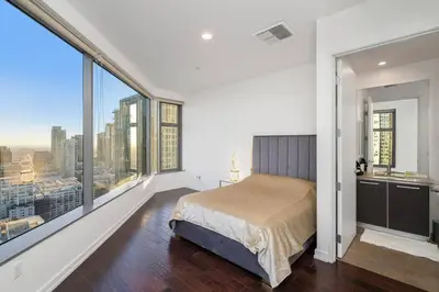 a bedroom with a bed and large windows at Downtown LA with the breathtaking view 2 bedrooms and parking space in Los Angeles