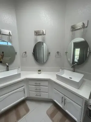 a white bathroom with two sinks and a mirror at Pristine & Smart freshly remodeled house! in Lancaster