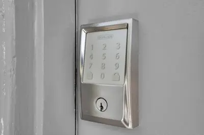 a close up of a remote control on a door at 6th Haven, Arcade, King Bed, Games, 1 Mile to Beaches in Long Beach