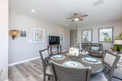 a dining room and living room with a table and chairs at Comfy and Stylish 4 Bathrooms 26 in Ridgecrest
