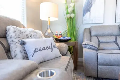 a living room with a couch and a chair at Luxury, Style and Comfort 4 Bathrooms 21 in Ridgecrest