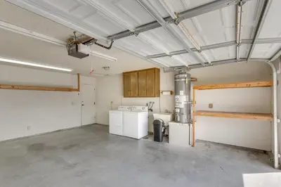 a kitchen with a washer and dryer in a room at Pet-Friendly Ridgecrest Home Near OHV Trails! in Ridgecrest