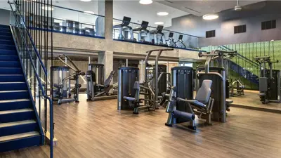 a gym with treadmills and elliptical machines at Stunning Hollywood Sign View in Los Angeles