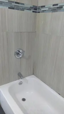 a white bath tub with a sink in a bathroom at Stuart Hotel in Los Angeles