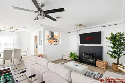 a living room with a couch and a fireplace at Modern Oasis with Pool & Jacuzzi near Universal Studios in Los Angeles