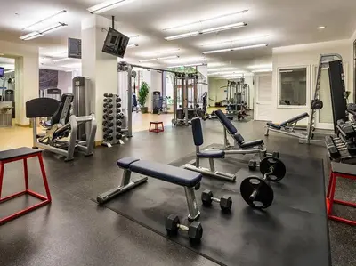 a gym with several treadmills and machines at 1 Bedroom XL Condo with King bed, Garden View, Parking Included in Los Angeles