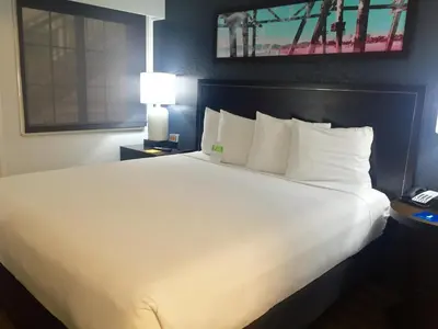 a large white bed in a hotel room at Hyatt House LAX Manhattan Beach in El Segundo
