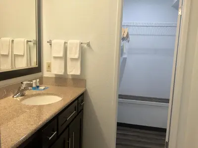 a bathroom with a sink and a shower at Hyatt House LAX Manhattan Beach in El Segundo