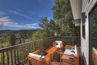 a balcony with benches and a view of the mountains at North Bay Chalet Views in Lake Arrowhead