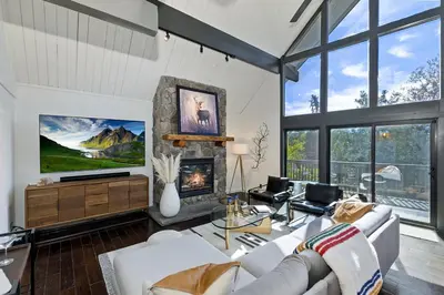a living room with a couch and a fireplace at North Bay Chalet Views in Lake Arrowhead