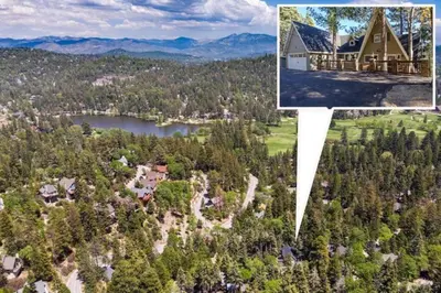 an aerial view of a house and a lake at The Muddy Moose- Spacious Family Getaway in Lake Arrowhead