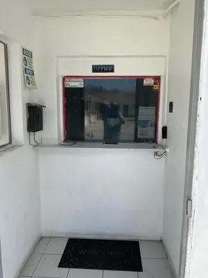 a person is standing in the door of a train station at State Motel in South Gate