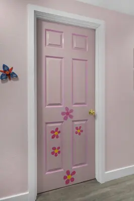 a pink door with flowers on it in a room at Pixar Pier by OC Adventure Homes in Anaheim