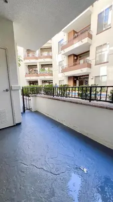 an empty balcony of a building with water on the floor at Modern Apartment in Trendy Area in Los Angeles