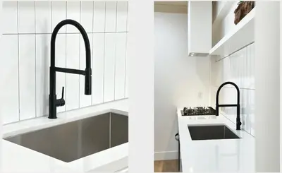 a white kitchen with a sink and a sinkiterator at Broskin apartments in Los Angeles