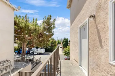 a balcony with a door leading to a parking lot at Central Hollywood Apartment in Los Angeles